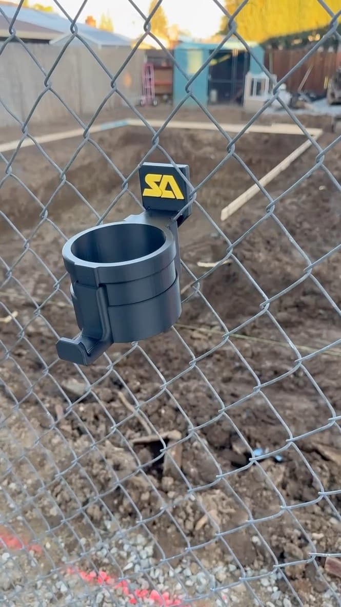 Custom team drink holder installed on a chain-link fence