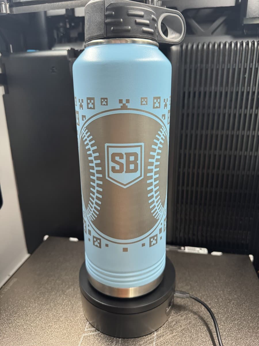 Light-blue water bottle with SB baseball emblem