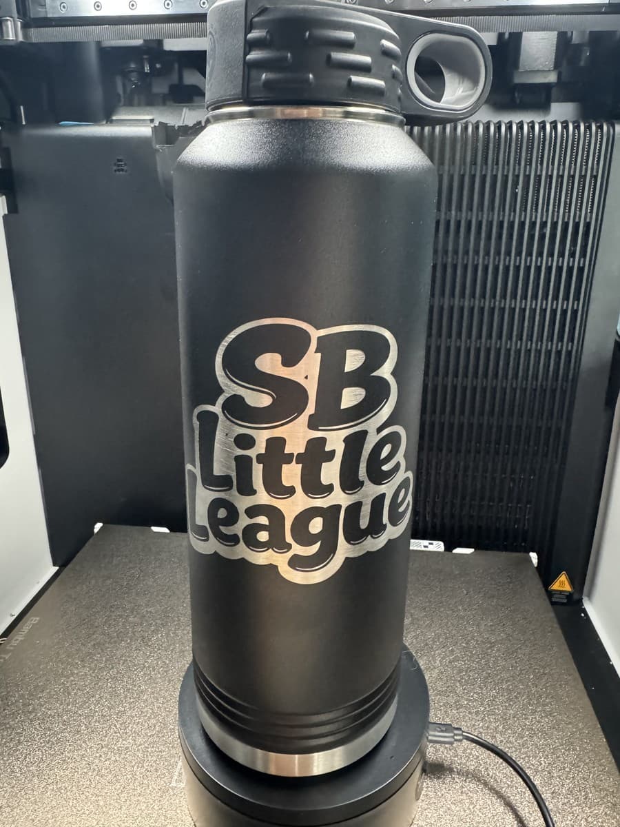 Black water bottle with SB Little League lettering