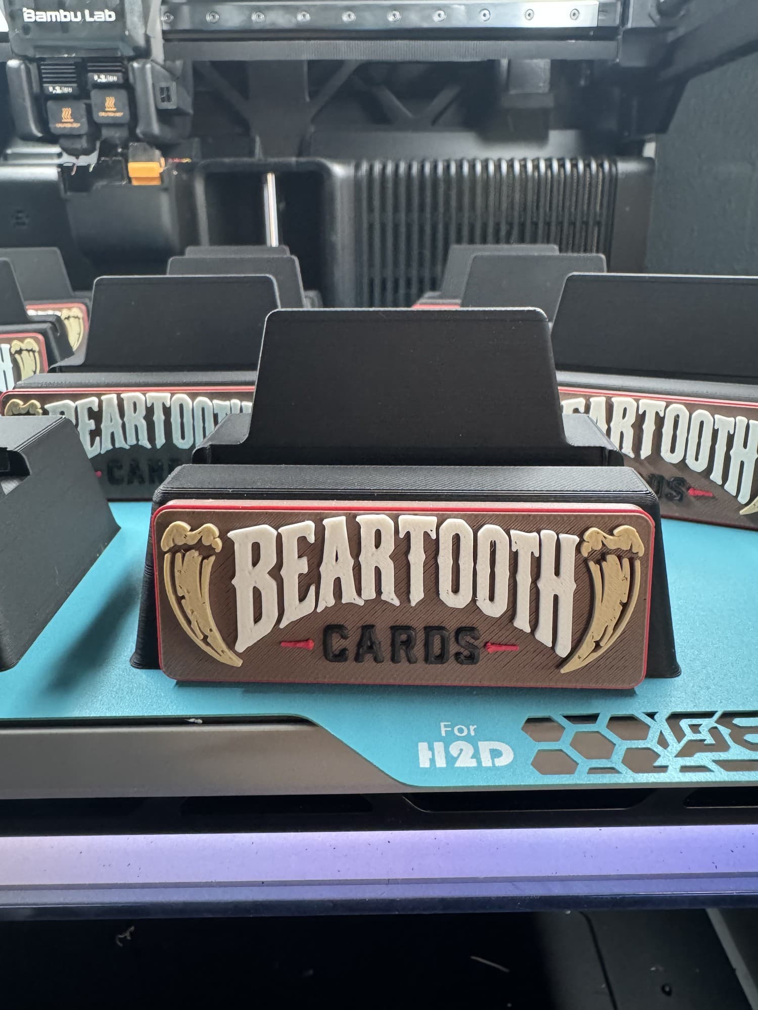 Close-up of a multicolor custom BearTooth Cards display stand