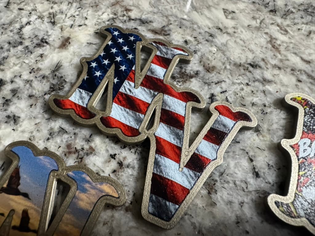Raised NV helmet decal with American flag artwork and a contrasting border