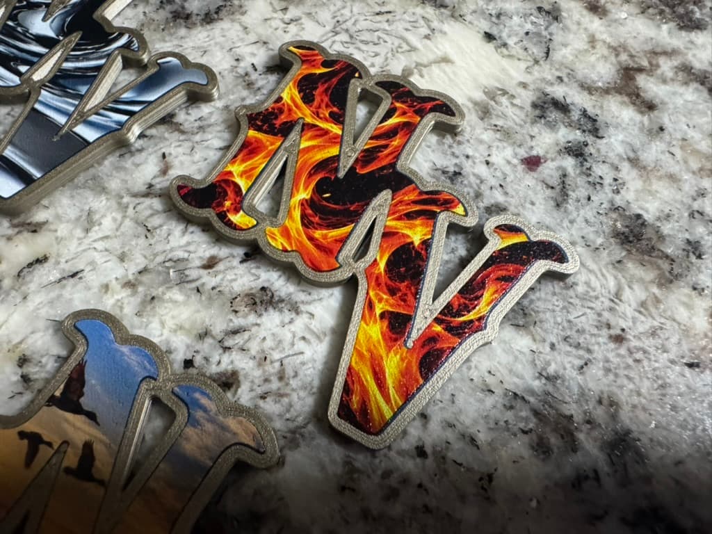 Raised NV helmet decal with orange and yellow flame artwork