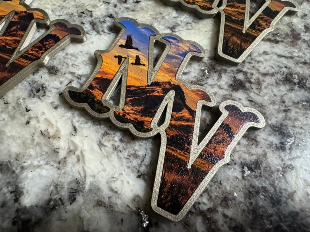Raised NV helmet decal with sunset landscape and flying birds