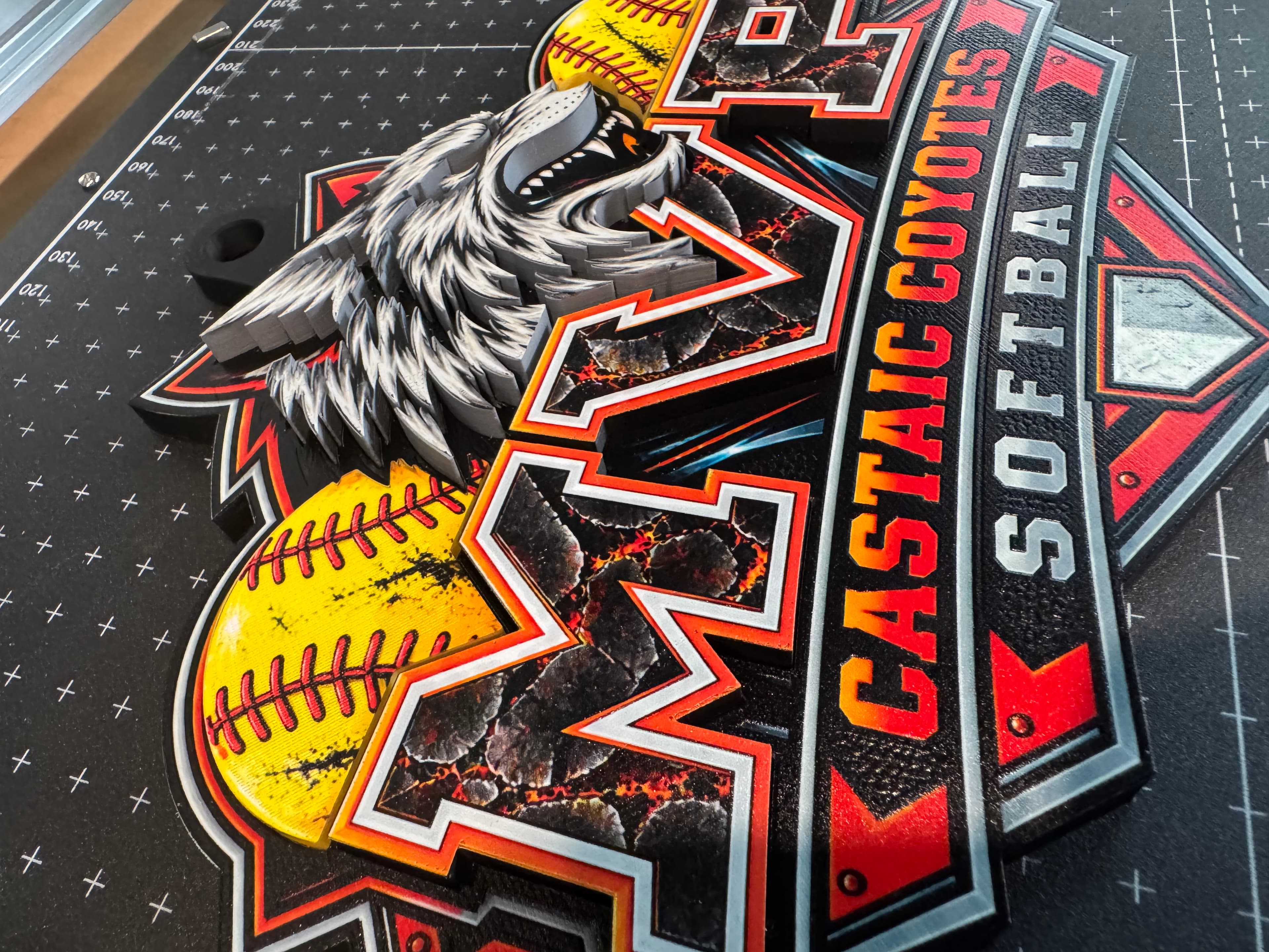 Angled view showing the raised coyote mascot and stacked MVP letter layers