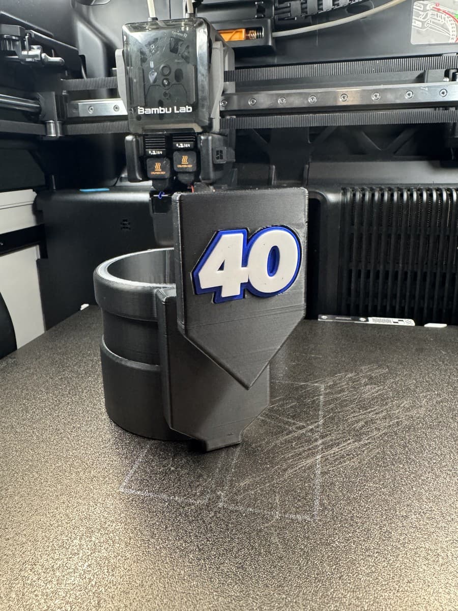 3D-printed fence drink holder with number 40 panel