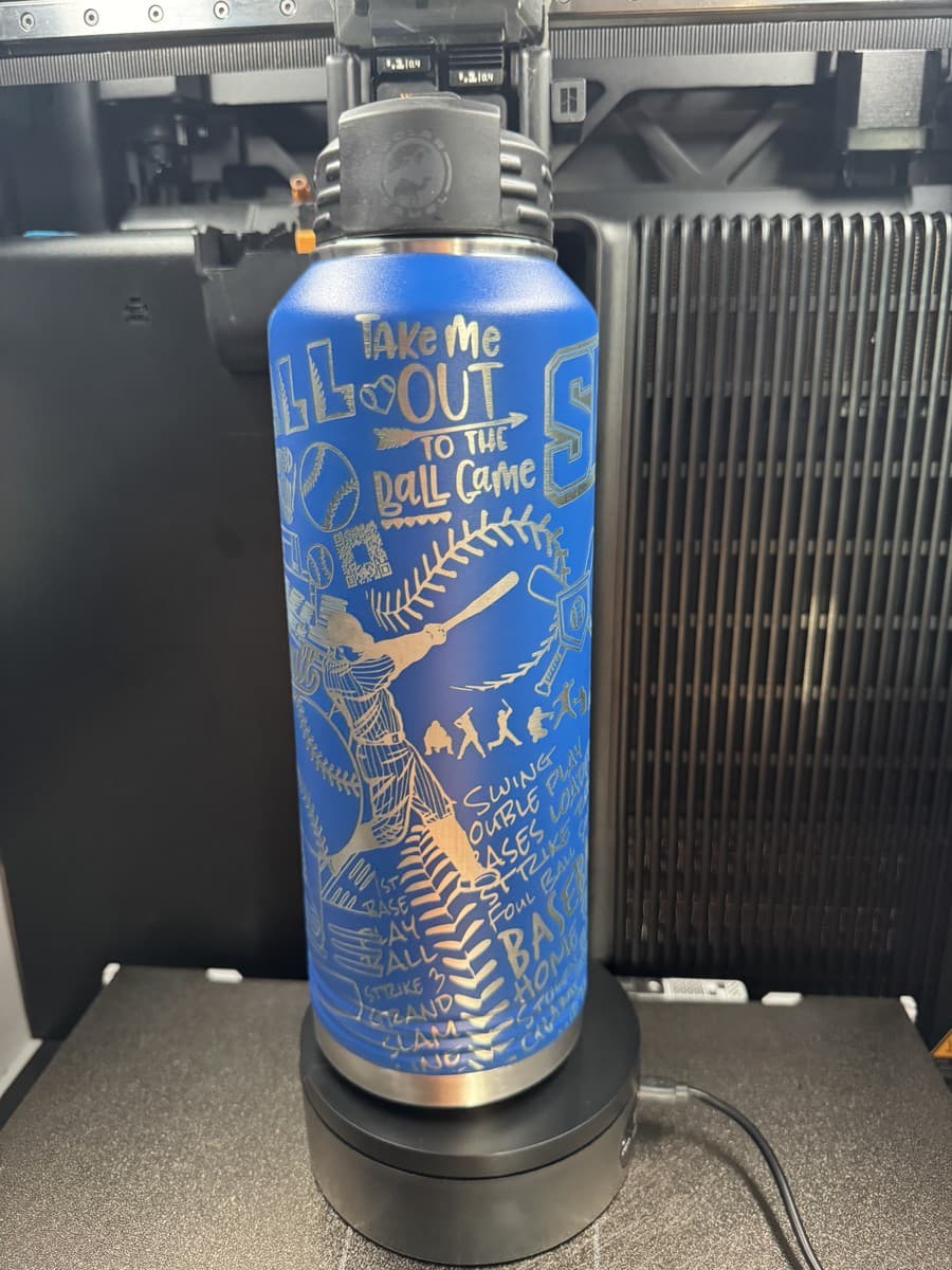 Alternate side of blue water bottle with baseball lettering and wrap artwork