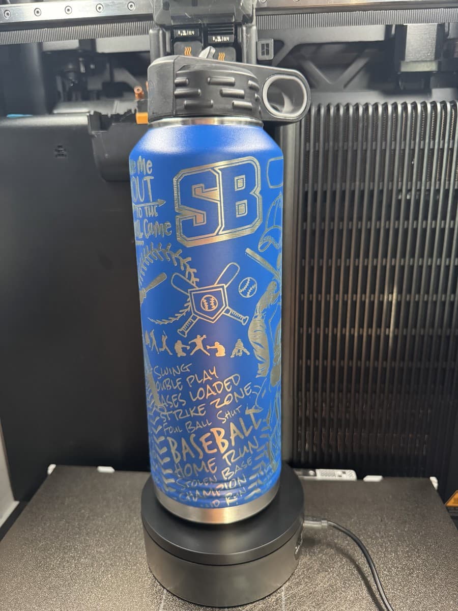 Blue water bottle with SB lettering and baseball wrap artwork
